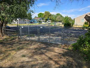 View of yard featuring a gate and a residential view