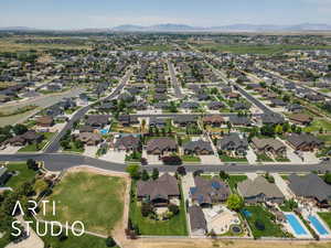 Aerial overview of property's location with nearby suburban area and mountains