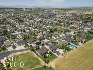 Aerial overview of property's location with mountains and nearby suburban area