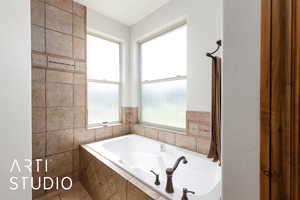 Full bathroom featuring a bath