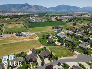 Aerial view of property and surrounding area featuring mountains