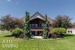 Rear view of property featuring a patio area