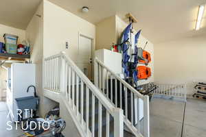 Staircase featuring concrete floors