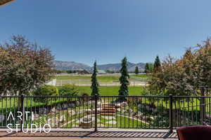Balcony featuring a mountain view and a rural view