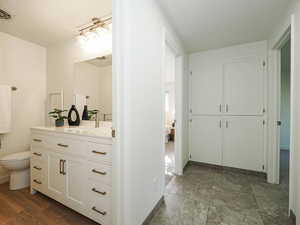 Bathroom with vanity and ensuite bath