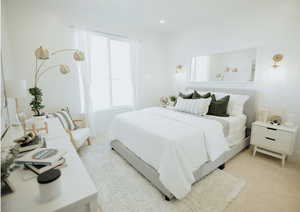 Bedroom with light carpet