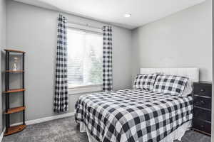 Bedroom with carpet floors, multiple windows, and recessed lighting