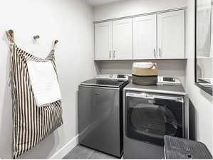 Laundry area with washing machine and clothes dryer and cabinet space