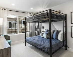 Carpeted bedroom featuring baseboards