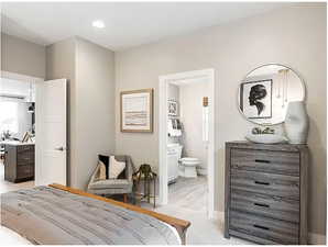 Bedroom featuring ensuite bath and recessed lighting