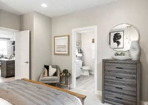 Bedroom with ensuite bath and recessed lighting