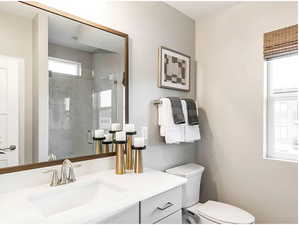 Full bathroom with a marble finish shower and vanity