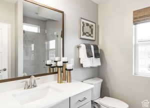Full bathroom featuring a shower stall and vanity
