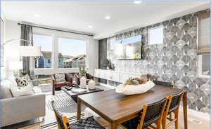 Dining room with healthy amount of natural light and recessed lighting
