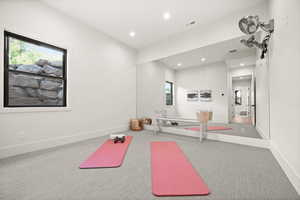 Exercise area featuring carpet flooring and recessed lighting
