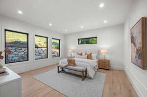 Bedroom featuring multiple windows, recessed lighting, and light wood finished floors