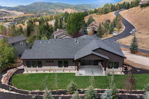 View of subject property with a mountain backdrop