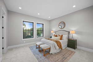Bedroom with light carpet and recessed lighting