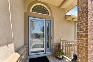 Property entrance with stucco siding