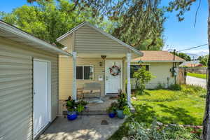 View of front of home with a mountain view and roof with shingles