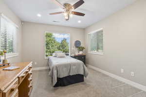 Bedroom featuring carpet, ceiling fan, and recessed lighting
