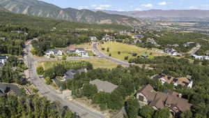 View of property location with a mountain backdrop and nearby suburban area