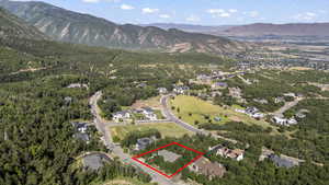 Aerial overview of property's location with property boundaries highlighted and nearby suburban area