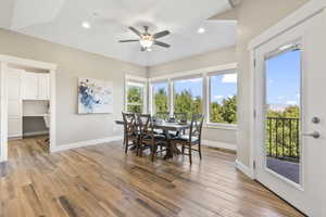 Dining area with ceiling fan, light wood-type flooring, and recessed lighting