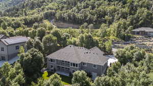 View of subject property with a heavily wooded area