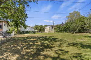 View of yard with an outdoor structure
