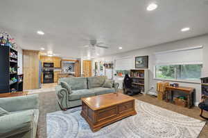Living room featuring recessed lighting and ceiling fan
