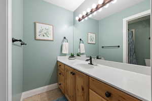 Bathroom with vanity and tile floors
