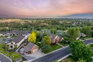 Aerial view of residential area featuring a mountainous background