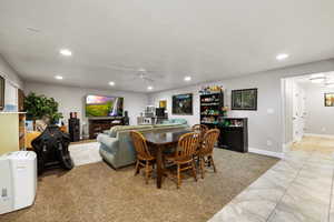 Dining space with recessed lighting, a ceiling fan, and light tile patterned floors