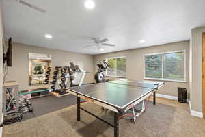 Rec room featuring ceiling fan, recessed lighting, and a textured ceiling