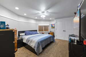Bedroom featuring carpet floors, a closet, recessed lighting, and ceiling fan