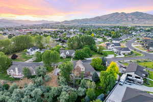 Aerial perspective of suburban area featuring a mountain backdrop