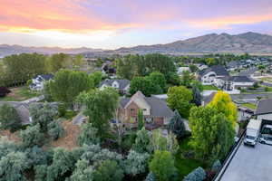 Aerial perspective of suburban area with a mountainous background