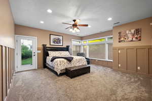 Carpeted bedroom featuring a textured ceiling, access to exterior, recessed lighting, and a ceiling fan