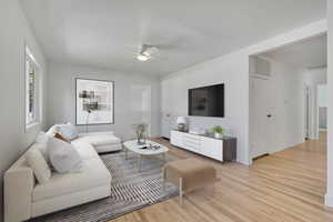 Open Great Room / Living Room featuring freshly finished hard wood floors, ceiling fan and recessed lighting.