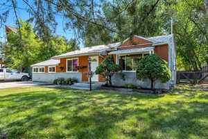 Updated Spacious 1 Level Living - 3 Bedroom / 2 Full Bath home with fun Open Space Park Like front yard and private backyard featuring workshop, shade trees, vegetable and flower gardens