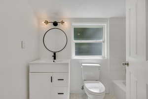 Updated Main Ensuite Bedroom with Full Private Full Bathroom, walk-in closet, recessed lighting and vaulted ceiling.