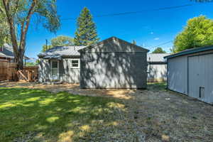 Private Backyard including a spacious workshop with metal roof and large storage with metal roof.