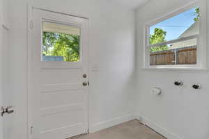Laundry Room with 220 Electric Outlet and Door to private Backyard.