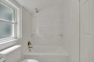 Updated Main Ensuite Bedroom with Full Private Full Bathroom, walk-in closet, recessed lighting and vaulted ceiling.