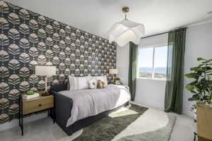 Bedroom featuring wallpapered walls, an accent wall, and carpet flooring