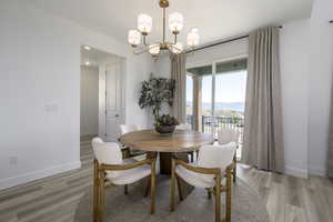 Dining space featuring a chandelier and light wood-style floors