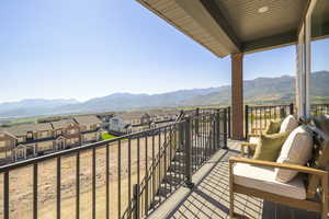 Balcony with a mountain view and a residential view