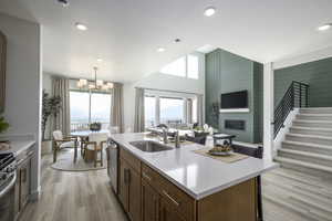 Kitchen with open floor plan, healthy amount of natural light, light countertops, dishwasher, and recessed lighting