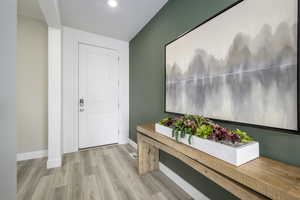 Entryway featuring light wood finished floors and baseboards